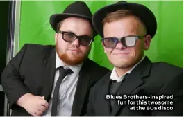  ??  ?? Blues Brothers-inspired fun for this twosome at the 80s disco