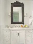  ??  ?? Master en SUITE antiqued mirror glass panels enhance the sense of space. Classic light antique glass, £350sq m, Antique mirror Glass. Avebury mixer tap, £1,130, Fired earth, is similar