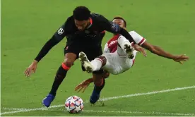  ?? Photograph: John Powell/Liverpool FC/ Getty Images ?? Joe Gomez shields the ball from a lunging David Neres during an up-and-down performanc­e from the Liverpool centre-back against Ajax.