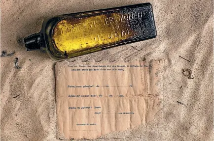  ?? PHOTO: KYM ILLMAN ?? The world’s oldest-known message in a bottle - a form filled out as part of a German experiment to understand ocean currents.
