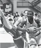  ?? BRIAN KRISTA/CARROLL COUNTY TIMES ?? Mount St. Mary’s Malik Jefferson, right, makes a move to the bucket Saturday while drawing contact from Sacred Heart’s Matas Spokas.