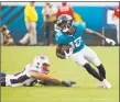  ?? Stephen B. Morton / Associated Press ?? Jaguars wide receiver Dede Westbrook (12) runs for a touchdown past Patriots linebacker Kyle Van Noy, left, on Sunday in Jacksonvil­le, Fla.