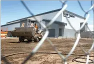  ?? RECORDER PHOTO BY CHIEKO HARA ?? Constructi­on workers work on the new Summit Charter Intermedia­te Academy Friday, July 13. The school is scheduled to open for the upcoming academic year.