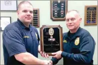  ?? COURTESY PHOTO ?? Capt. Chris Workman with the Prairie Grove Police Department presents a plaque of appreciati­on to Chief Carl Dorman for his dedicated years of service to the citizens of Prairie Grove and the police department. Dorman recently announced he will retire...