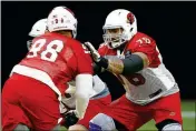  ?? ASSOCIATED PRESS ?? ARIZONA CARDINALS offensive guard Mike Iupati (76) blocks defensive tackle Corey Peters, right, during a practice Monday, in Glendale, Ariz.