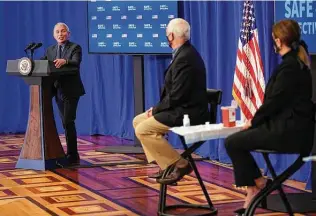  ?? Andrew Harnik / Associated Press ?? Dr. Anthony Fauci, director of the National Institute for Allergy and Infectious Diseases, speaks as Vice President Mike Pence and wife Karen Pence listen.