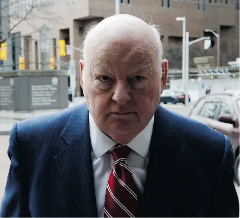  ??  ?? Senator Mike Duffy, a former member of the Conservati­ve caucus, arrives at the courthouse for his trial on Tuesday in Ottawa, where he took to the witness stand to face 31 charges of fraud, breach of trust and bribery.