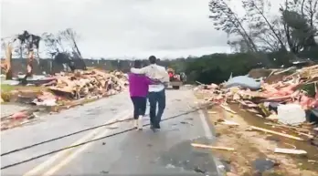  ??  ?? Families in Lee County lost everything as the tornado struck.