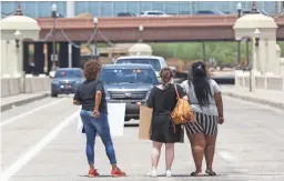  ??  ?? Protesters confront police Thursday in Tempe.