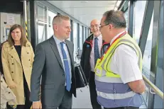 ??  ?? No stranger to Arran, Cabinet Secretary for Finance and the Constituti­on Derek Mackay greets CalMac Port Manager Colin McCort.