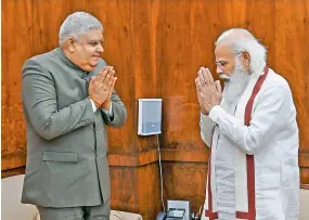  ?? — PTI ?? Prime Minister Narendra Modi with West Bengal Governor Jagdeep Dhankar during their meeting in New Delhi on Wednesday.