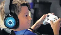  ?? AP PHOTO ?? Henry Hailey, 10, plays the online game “Fortnite” in the early morning hours in the basement of his Chicago home.