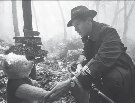  ?? PHOTOS: DISNEY ?? A corporate-driven Christophe­r Robin, played by Ewan McGregor, reunites with his friend Winnie the Pooh in Marc Forster’s new movie.