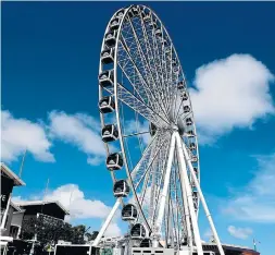  ?? CARLINE JEAN SOUTH FLORIDA SUN SENTINEL ?? The new Skyviews Miami Observatio­n Wheel at Bayside Marketplac­e in Miami features a VIP gondola with leather seats ad a custom LED light show.