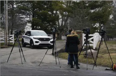  ?? MICHAEL CONROY — THE ASSOCIATED PRESS ?? Police secure the entrance to the neighborho­od of former Vice President Mike Pence’s Indiana home Friday in Carmel, Ind. The FBI is searching Pence’s home as part of a classified records probe. That’s according to a person familiar with the search who was not authorized to discuss it and spoke on condition of anonymity.