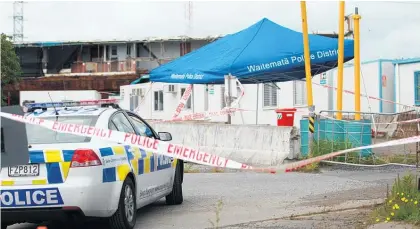  ?? Picture / Doug Sherring ?? The crime scene at the constructi­on depot on Selwood Rd, Henderson, at which Charanpree­t Dhaliwal (below) died of multiple skull fractures.