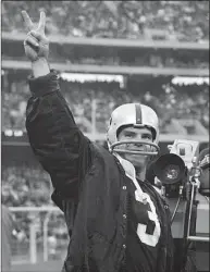  ?? Reister / Associated Press ?? Raiders quarterbac­k Daryle Lamonica gives the victory sign after his team beat the Kansas City Chiefs in 1968.