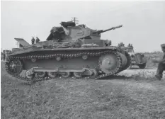  ??  ?? ■ The advance into Poland in September 1939. A Panzer II halts by the roadside as soft-skinned transport rolls by.