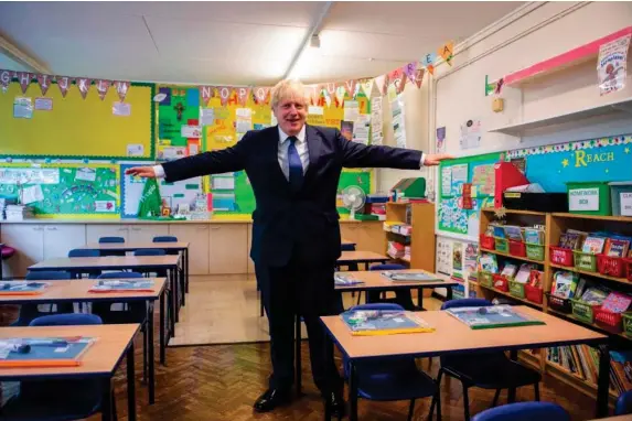  ?? (AFP/Getty) ?? Wide of the mark? The PM visits a school in London yesterday