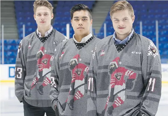  ?? — VANCOUVER GIANTS ?? From left, Vancouver Giants’ Taden Rattie, Ryan Jones and Johnny Wesley show off the ugly Christmas sweater jerseys.