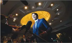  ?? CP PHOTO ?? Prime Minister Justin Trudeau stops to speak to media as he arrives to the India Canada Business Session in New Delhi, India on Thursday.
