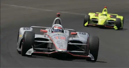  ?? AP PHOTO/AJ MAST ?? Will Power, of Australia, leads Simon Pagenaud, of France, though the first turn during the Indianapol­is 500 auto race at Indianapol­is Motor Speedway, in Indianapol­is, on Sunday.