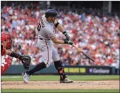  ?? AARON DOSTER — THE ASSOCIATED PRESS ?? The San Francisco Giants' Evan Longoria hits a solo home run during the sixth inning Saturday against the Cincinnati Reds in Cincinnati.