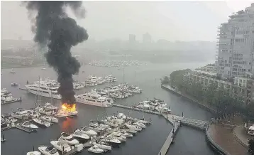  ??  ?? Witnesses reported hearing a huge explosion as a pleasure craft caught fire at the Quayside Marina in Yaletown at around noon on Thursday. No injuries were reported.