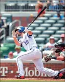  ?? TODD KIRKLAND / The Associated Press ?? Atlanta’s Charlie Culberson takes a swing during a game earlier this season vs. the Baltimore Orioles.