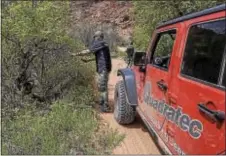  ?? SUBMITTED PHOTO ?? A Quadratec employee helps with trail maintenanc­e in Hey Joe Canyon in Moab, Utah. West Goshen-based Quadratec works with Jeep clubs across the country on environmen­tal projects.