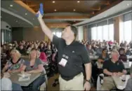  ?? THE ASSOCIATED PRESS ?? Clark Aposhian, president of the Utah Shooting Sport Council, holds a plastic gun Dec. 27, 2012, during a concealed weapons training session for 200 Utah teachers in West Valley City, Utah. The Utah Shooting Sports Council offered six hours of training...