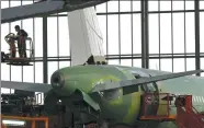  ?? REUTERS ?? An employee works on the fuselage of an A320 plane at Airbus A320 Family final assembly line in Tianjin.