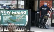  ?? (AP PHOTO/NAM Y. HUH) ?? A hiring sign is displayed outside of a Starbucks in Schaumburg, Ill., Friday, April 1, 2022.