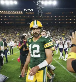  ?? ARMANDO L. SANCHEZ — CHICAGO TRIBUNE ?? Green Bay Packers quarterbac­k Aaron Rodgers walks off the field after the Packers defeated the Chicago Bears 27-10 on Sept. 18, 2022, at Lambeau Field in Green Bay, Wis.