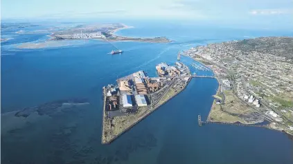  ?? PHOTO:SUPPLIED ?? Big picture . . . Eight percent of Southland businesses export, but 44% are in the export supply chain. Foreground, South Port at Bluff township, and background, NZAS’ aluminium smelter and its wharf.