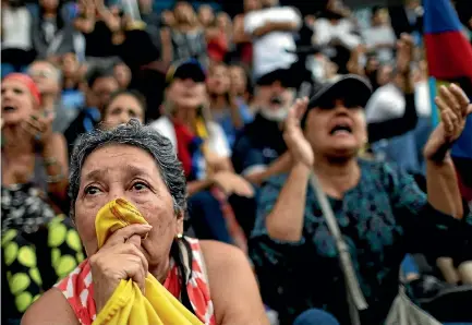  ?? PHOTOS: REUTERS ?? A woman weeps during an opposition rally in Caracas yesterday paying tribute to the victims of violence during the protests against Venezuelan President Nicolas Maduro’s government.