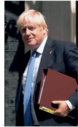 ?? ?? FORMER BRITISH PRIME MINISTER Boris Johnson leaves 10 Downing Street to attend the weekly Prime Minister’s Questions at the Houses of Parliament in July 2022.