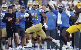  ?? MARCIO JOSE SANCHEZ – THE ASSOCIATED PRESS ?? UCLA's Zach Charbonnet led all Pac-12running backs last season with seven 100-yard rushing games and finished the season with 1,137 yards and 13 touchdowns on the ground.