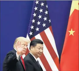  ?? Andy Wong Associated Press ?? SOME EXPERTS are calling on President Trump and Chinese President Xi Jinping to meet face to face soon to prevent the situation from getting out of control.