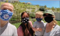  ?? Courtesy photo ?? Debbie Beydler, not pictured, has made hundreds of masks for area hospitals. Here, her family shows off masks she made them.