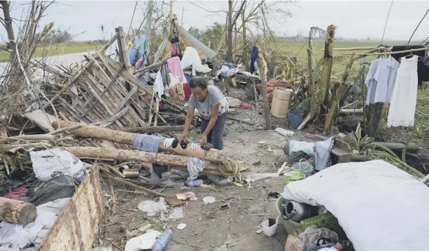  ?? PICTURE: TED ALJIBE / AFP ?? 0 China is bracing itself for devastatio­n on the scale Typhoon Mangkhut wreaked on the northern Philippine­s, where it caused at least 30 deaths