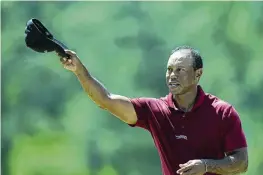  ?? DAVID J. PHILLIP / AP ?? Tiger Woods waves after his final round at the Masters golf tournament at Augusta National Golf Club on April 14 in Augusta, Ga.