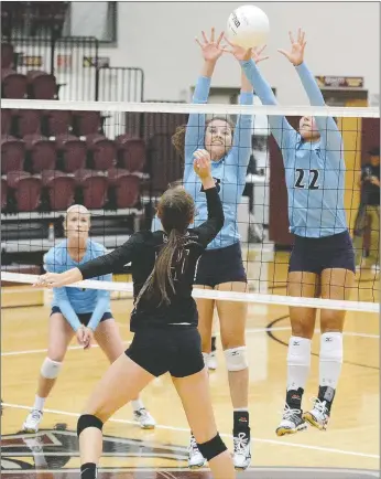  ?? Bud Sullins/Special to the Herald-Leader ?? Springdale Har-Ber senior middle hitters Jaden Williams, middle, and Klaire Trainor attempt to block the hit of Siloam Springs sophomore Chloe Price during Monday’s season-opening match at Panther Activity Center. The Lady Wildcats swept the Lady...