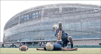  ?? | PETER MORRISON~AP ?? Navy players warm up during a training session Thursday at the Aviva Stadium in Dublin.