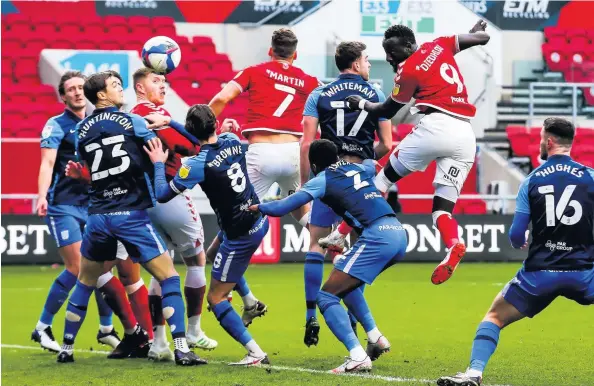  ??  ?? Bristol City’s Famara Diedhiou rises high to score with a header in Saturday’s Championsh­ip game against Preston