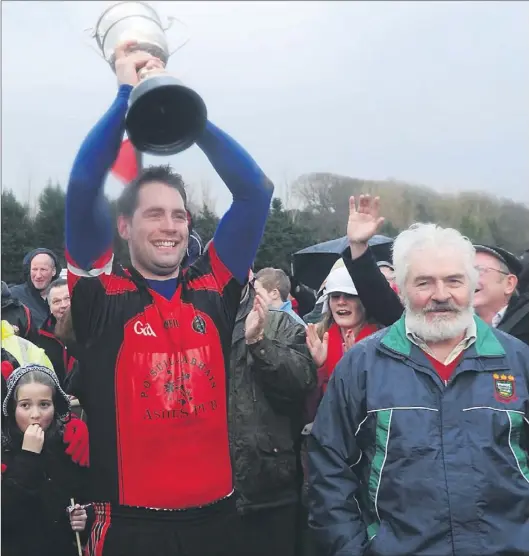  ?? PICTURE: MICHELLE COOPER GALVIN ?? Team captain — and man-of-the-match — Raymond O'connor lifts the O'sullivan Cup after Glenbeigh / Glencar defeated Laune Rangers in the Mid Kerry Senior Championsh­ip Final in Beaufort on Saturday