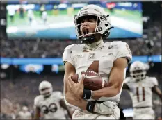  ?? ADAM HUNGER — THE ASSOCIATED PRESS ?? Army quarterbac­k Christian Anderson (4) reacts to scoring a touchdown against Navy during the first half of Saturday’s game in East Rutherford, N.J.