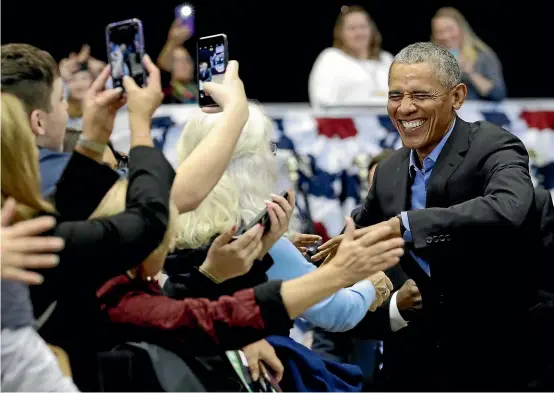  ?? AP ?? Barack Obama greets Democrat supporters at the rally in Gary, Indiana, in the run up to the midterm elections in the United States.