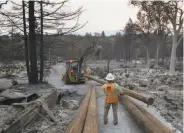  ?? Paul Kuroda / Special to The Chronicle ?? A PG& E crew works in a Glen Ellen neighborho­od that was destroyed in the Wine Country fires.