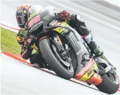  ?? — AFP photo ?? Monster Yamaha Tech 3’s Malaysian rider Hafizh Syahrin negotiates a corner during the second practice session of the Malaysia MotoGP at the Sepang Internatio­nal circuit in Sepang.